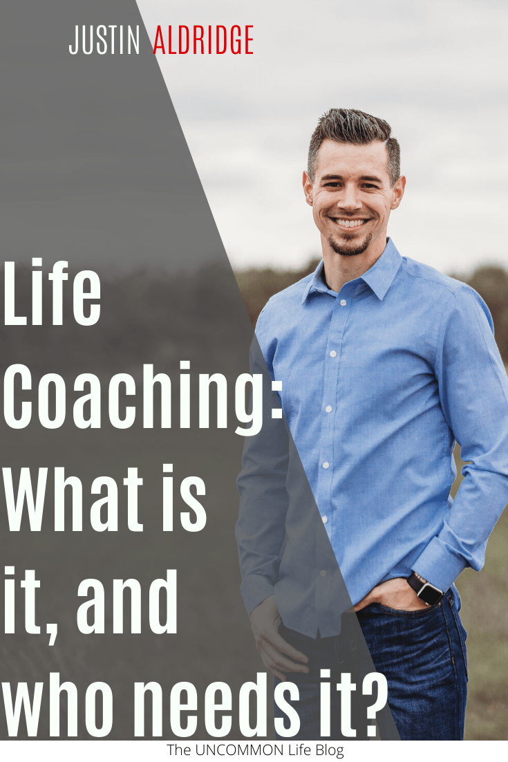 Picture of man in blue button down shirt and blue jeans standing in a field behind the text, "Life Coaching: What is and, who needs it?"